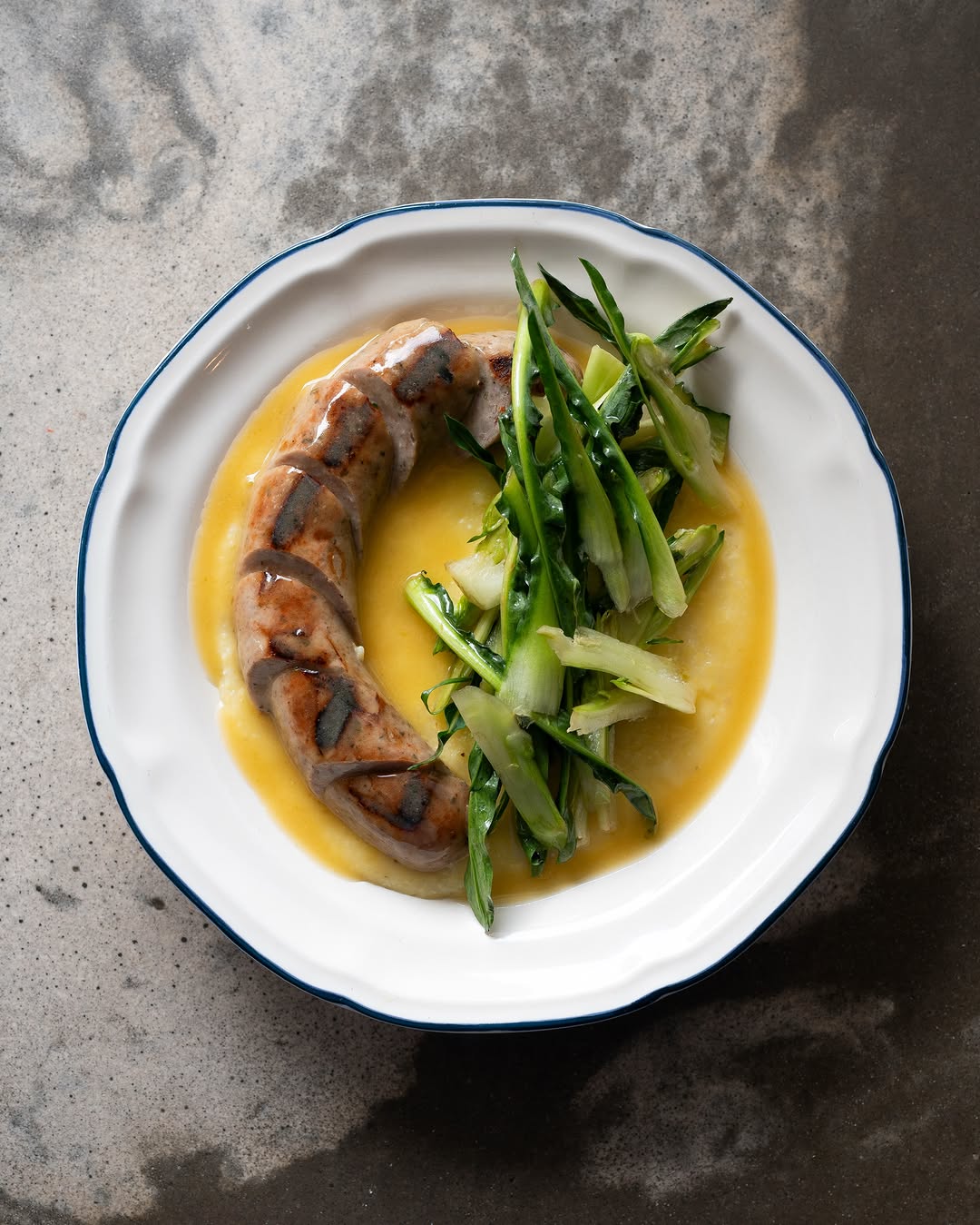 rosemary & white wine sausage, polenta & puntarelle