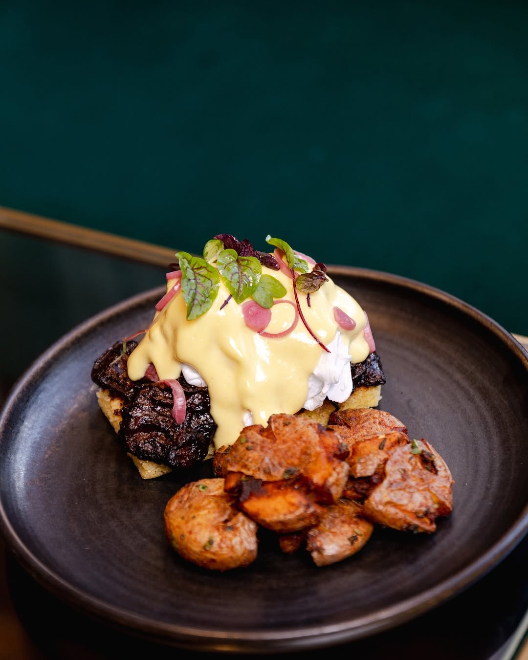 If Monday has to happen, at least there's brunch. Meet our Bison Brisket Benedict: the cure for early alarms, overflowin