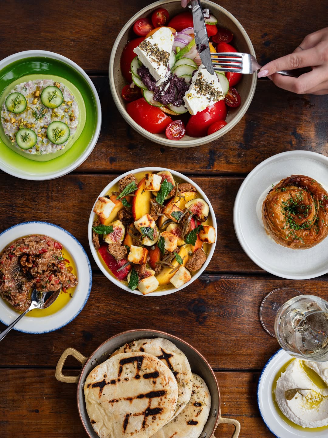 A taste of the Greek table, one dish at a time. Swipe to discover what’s being served.
