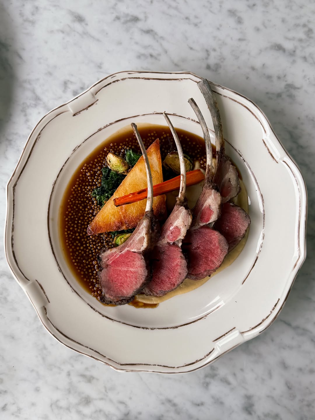 One of our newest additions to the menu at La Petite Iza. Roasted lamb rack with parsnip, pomme Anna, and sauce Robert.