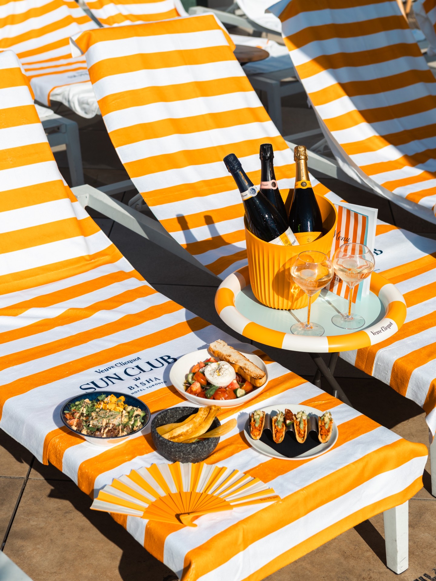 Bright skies, yellow umbrellas, and Veuve Clicquot RICH over ice ☀️